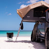 Camping chair next to Ute on Fraser Island beach